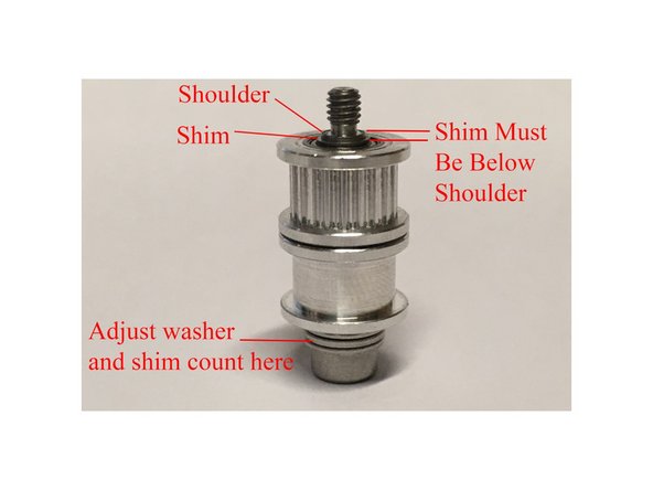 Insert an M3 x 10mm Button head bolt into the bottom of the X Carriage, and an M3 x 16mm bolt into the long horizontal hole in the X carriage, until they're flush with the inside edge.