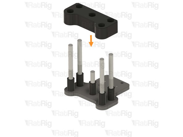 Places one aluminium spacer onto each screw