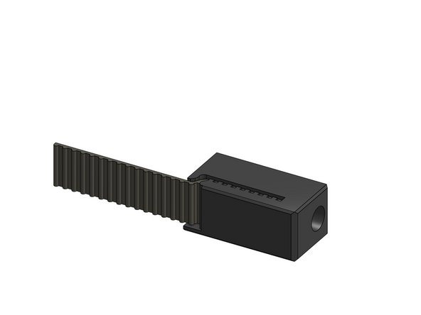 Slide the belts that are in the back of the X gantry into the tension blocks, repeat for 2 blocks