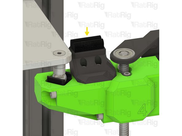 Secure the nozzle wiper to the bed arm as shown.