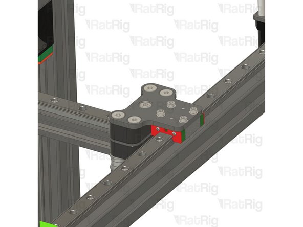 Insert an M3x8 Cap Head screw with an M3 washer through the joiner plate and tighten it to the linear rail carriage