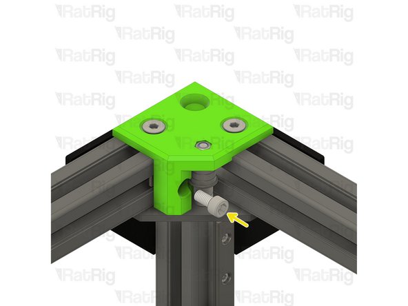 Place the 3030 T-nut into the extrusion channel and slide it under the CoreXY idler as shown. Position the T-nut so that you are able to see it though the marked hole