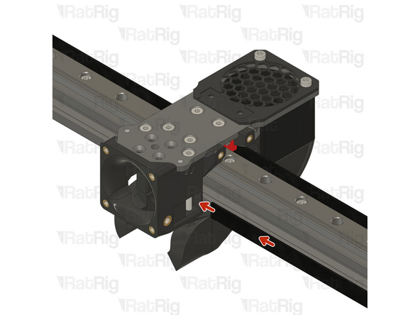 Insert the belt in the designated slot, and ensure the belt end is fed from behind the screw.