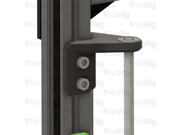 Fasten both M6x12 Cap Head Screws to secure the constraint assembly to the V-Core 3 frame