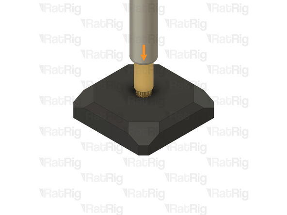 Apply gentle downward pressure to guide the heat insert into the printed part