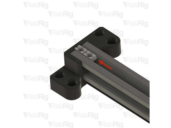 Push the two T-nuts to the end of the extrusion slot, so they touch the printed part