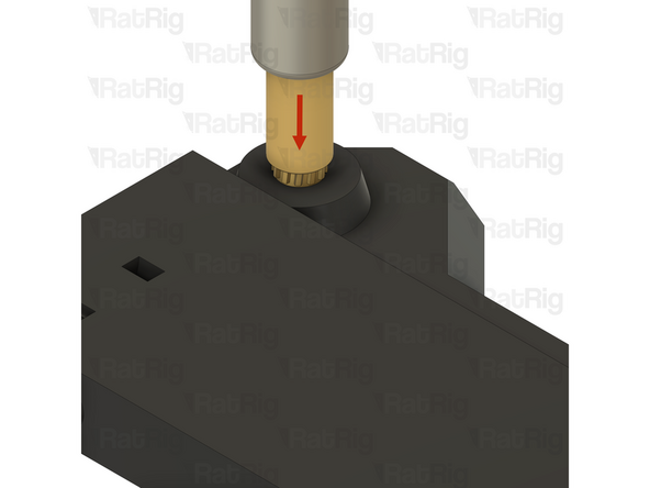 Slowly press the heat insert into the printed part