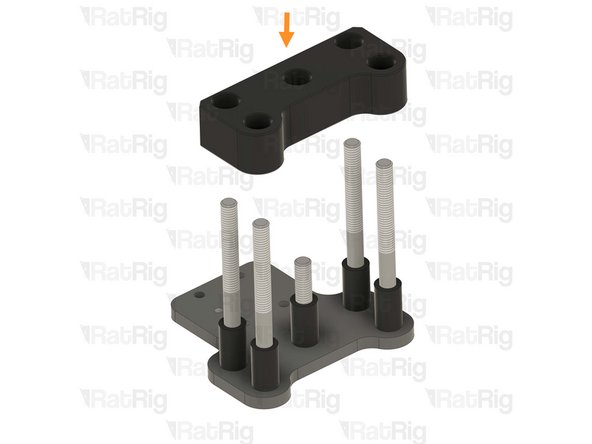 Places one aluminium spacer onto each screw