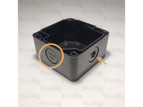 Open a hole on the emergency button body, either by snapping a removable disk or drilling a hole