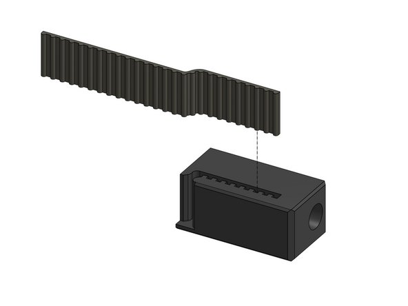 Slide the belts that are in the back of the X gantry into the tension blocks, repeat for 2 blocks