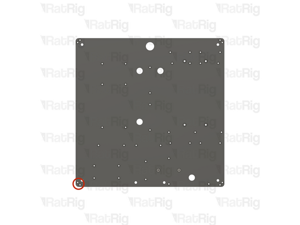 Locate the two marked holes in the base panel