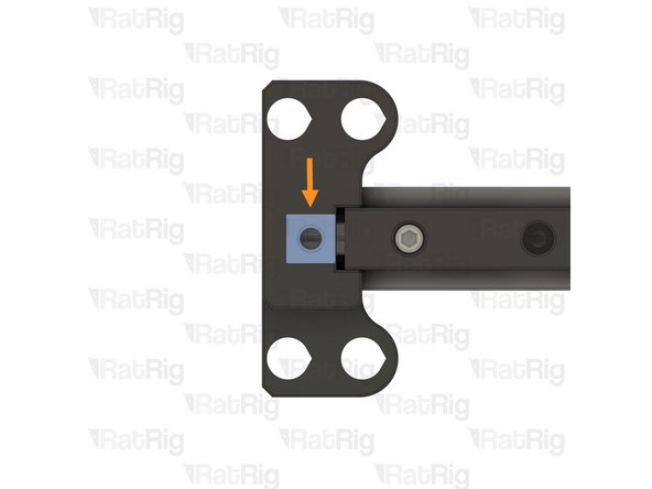 Flip the assembly upside down, and push the single T-nut underneath the printed part, ensuring it is aligned with the hole in the printed part