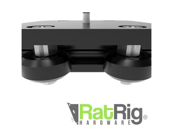 Before inserting your carriage on the main rail, use the 10mm wrench to turn each eccentric spacer to face outwards as shown. This means the stripe in facing away from the rail.