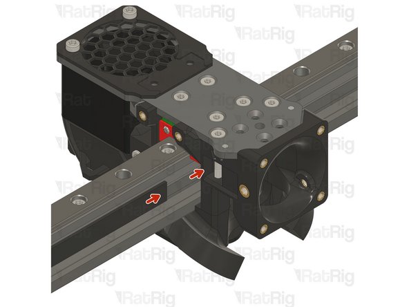 Insert the belt in the designated slot, and ensure the belt end is fed from behind the screw.