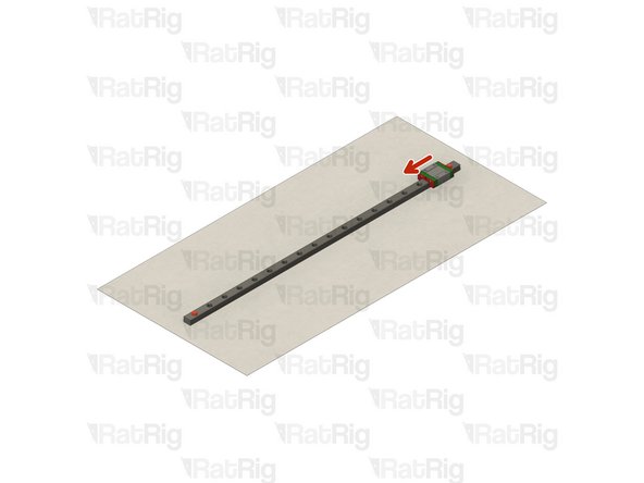 With the rail still on the absorbent paper towels, carefully and slowly move the carriage from one end of the rail to the other