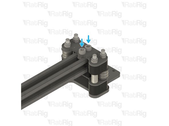 Insert the screws through the plate, and tighten them to the t-nuts on the 2020 extrusion.