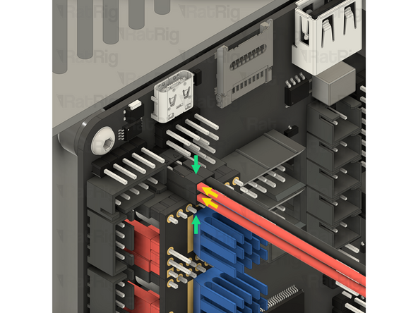 Connect both of the black Raspberry Pi power cables to the Octopus motherboard as shown