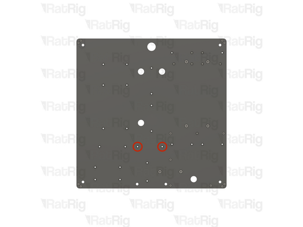 Locate the two marked holes in the base panel
