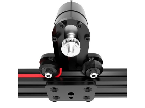 Slide the opposite tip of the Belt through the gap between the rail and the wheel of your slider’s carriage. Pick the tip on the opposite side and while holding the carriage in place, pull it until the Belt is tense and neatly lodged inside the lateral slot.