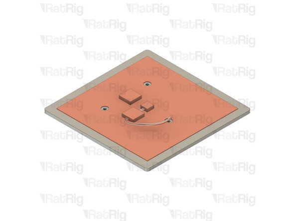 Remove the adhesive backing from the silicone heater and apply it to the V-Minion bed plate