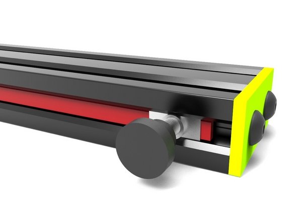 Pick up the tip of the Belt on the opposite side and slide it behind the other T-Nut, which should be placed near the end of the rail. Pull from the opposite side until the belt is snug against the rail.