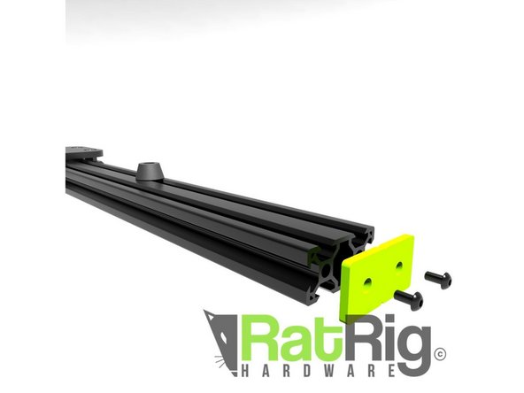 If you're building without slider legs, grab 4x button head screws, and 4x green endcaps. Assemble these on the rail ends.