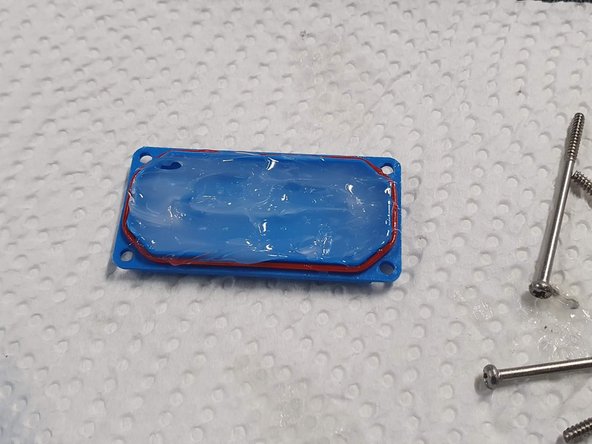 Fill the bottom plate with silicone grease