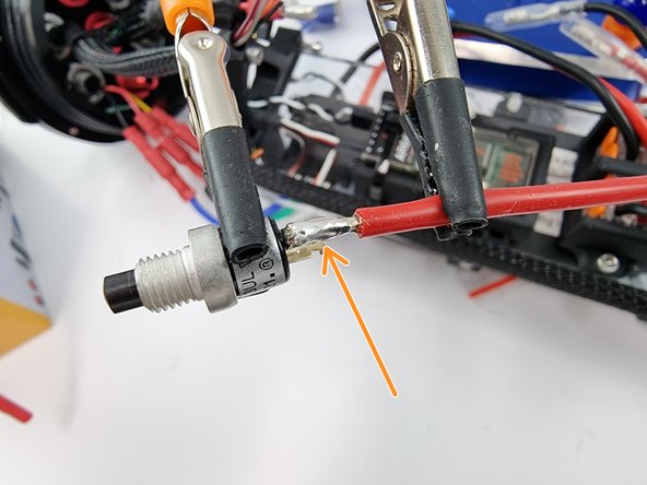 Solder the wire onto the tab of the power switch.