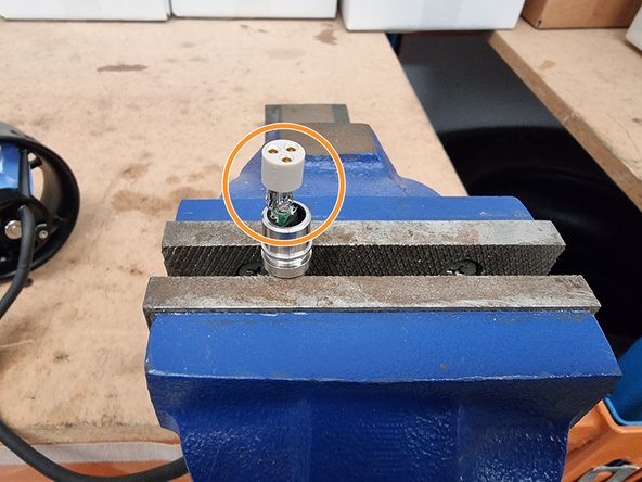 Feed the cable through the connector shell until the connector insert reaches the shell.