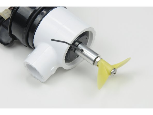 Apply one drop of Purple Loctite to the set screw and screw it all the way in, tighten the set screw securely against the flat part of the propeller shaft.