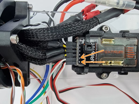 Channel 5 and 6 on the receiver are the ports to connect the 2 Dynamite ESC's too