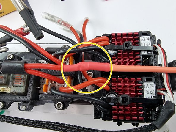 Once the soldered joint has cooled down slide the heat shrink over the soldered joint and apply heat to shrink it into place