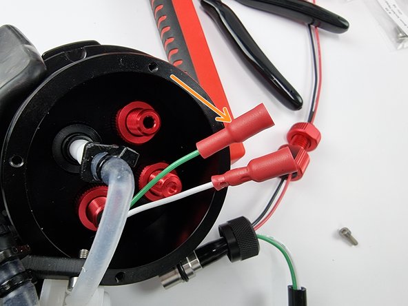 Place a female bullet connector onto the green wire.