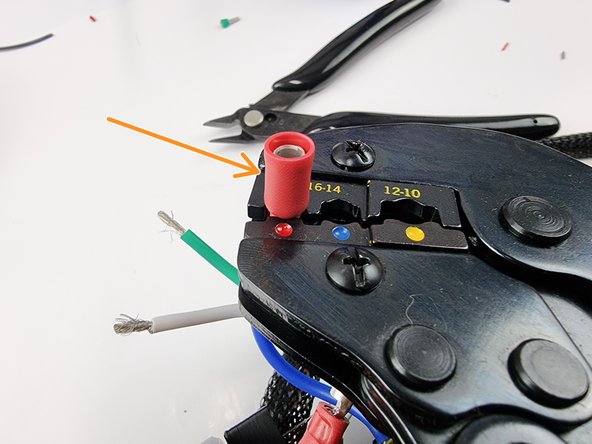 Crimp onto the wire ensuring the wire is inserted all the way into the connector