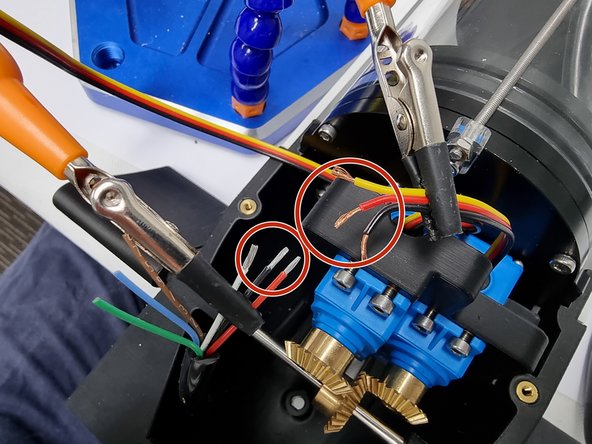 Strip the insulation from the ends of the wires.