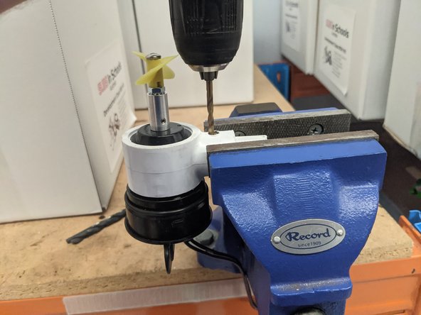 Mount the motor assembly in a vice, ensuring the surface to be drilled is held at a 90* angle.