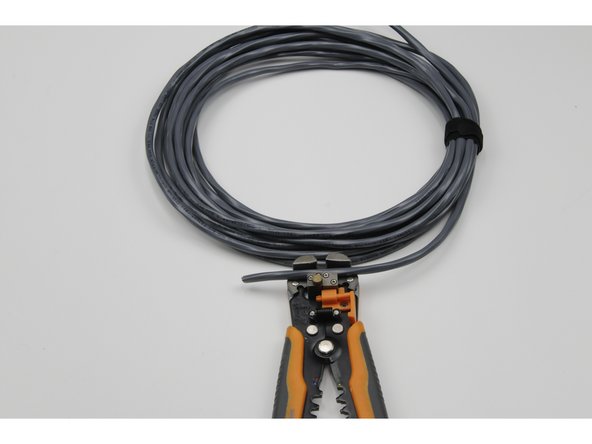 Do not nick any of the six coloured wires inside. If you do, cut the tether cable where you nicked an inside wire and start again.