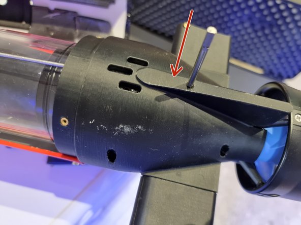 Slide the Large control surface onto the control rod.