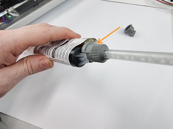 Install the nozzle onto the tube and twist on to lock it into place.