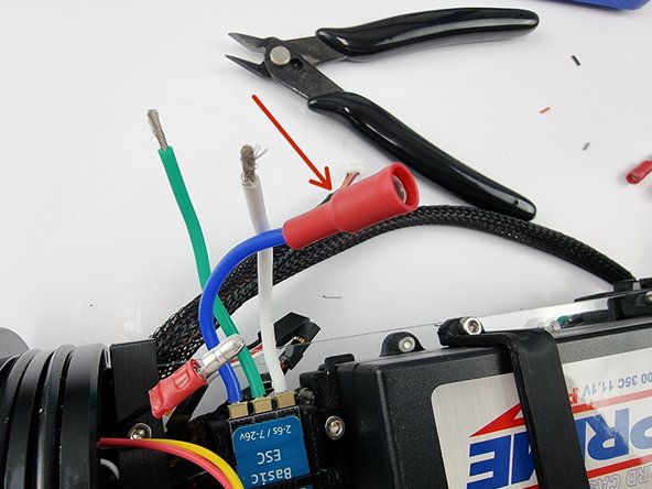Slide a female bullet connector onto the blue wire from the thruster ESC