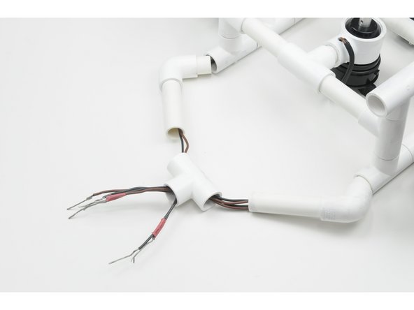 Now that the tether cable has been separated from the frame, and the individual motor wires are free, the internal wiring can be removed.