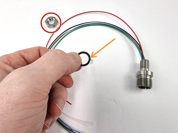 Remove the nut and the o-ring from the bulkhead connector