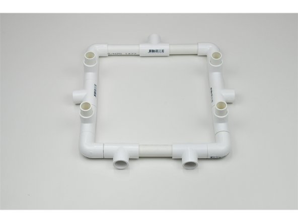 Place the 32mm Pipe Sections into the  upright Tee Connectors of the base.