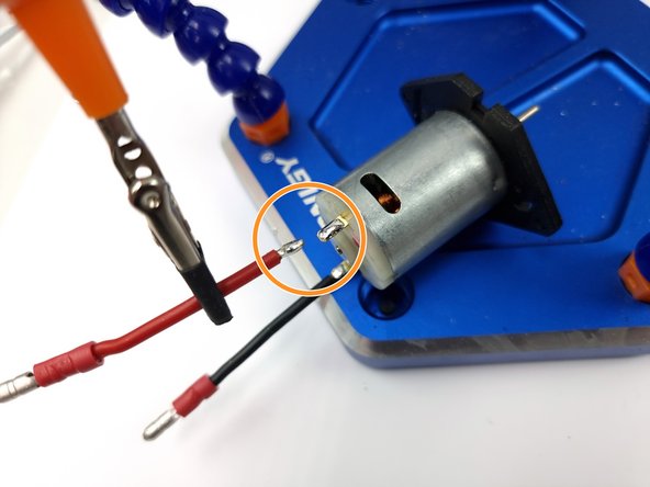 Using a soldering iron add some solder to the wire and also pad of the peristaltic pump.