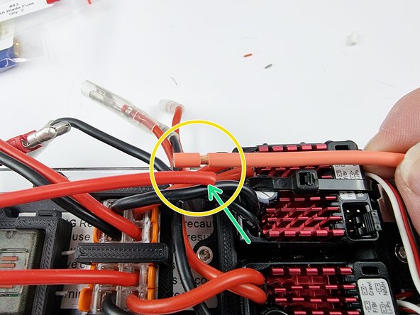 Place the wires together to gauge the length that you need to trim the wire from the power switch to.