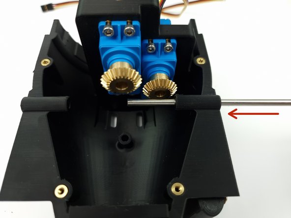 Slide the Control rod through the first hold of the Bottom Aft Cap.
