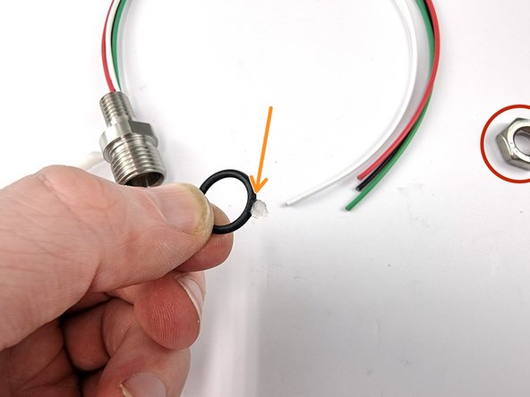 Remove the nut and the o-ring from the bulkhead connector