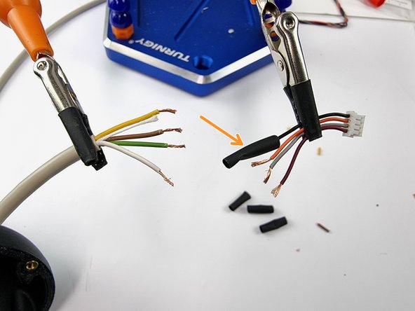 Trim the cable that connects to the satellite receiver and strip the insulation from the end of the wires.