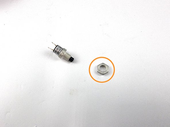 Unscrew the nut from the switch as this isn't required for our installation