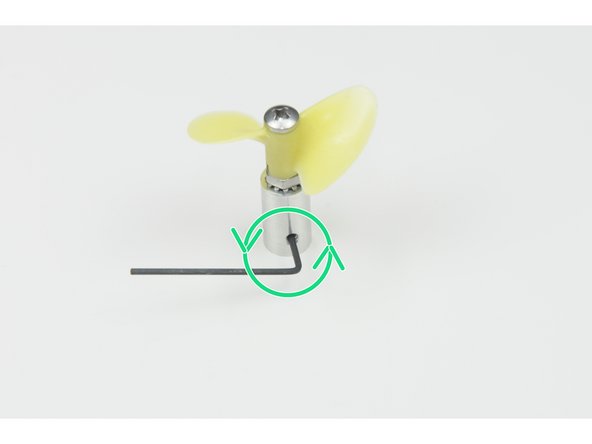 Unscrew the small set screw but do not remove it completely.